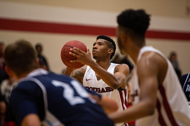 An IU Kokomo men's basketball player lines up his shot at the free throw line.